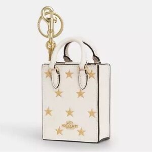 ⭐️COACH CX074, North South Mini Tote Bag Charm, Creamy White w/ Gold Stars, NWT